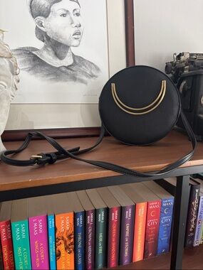 Anthropologie Black Round Crossbody with Gold Crescent Accents